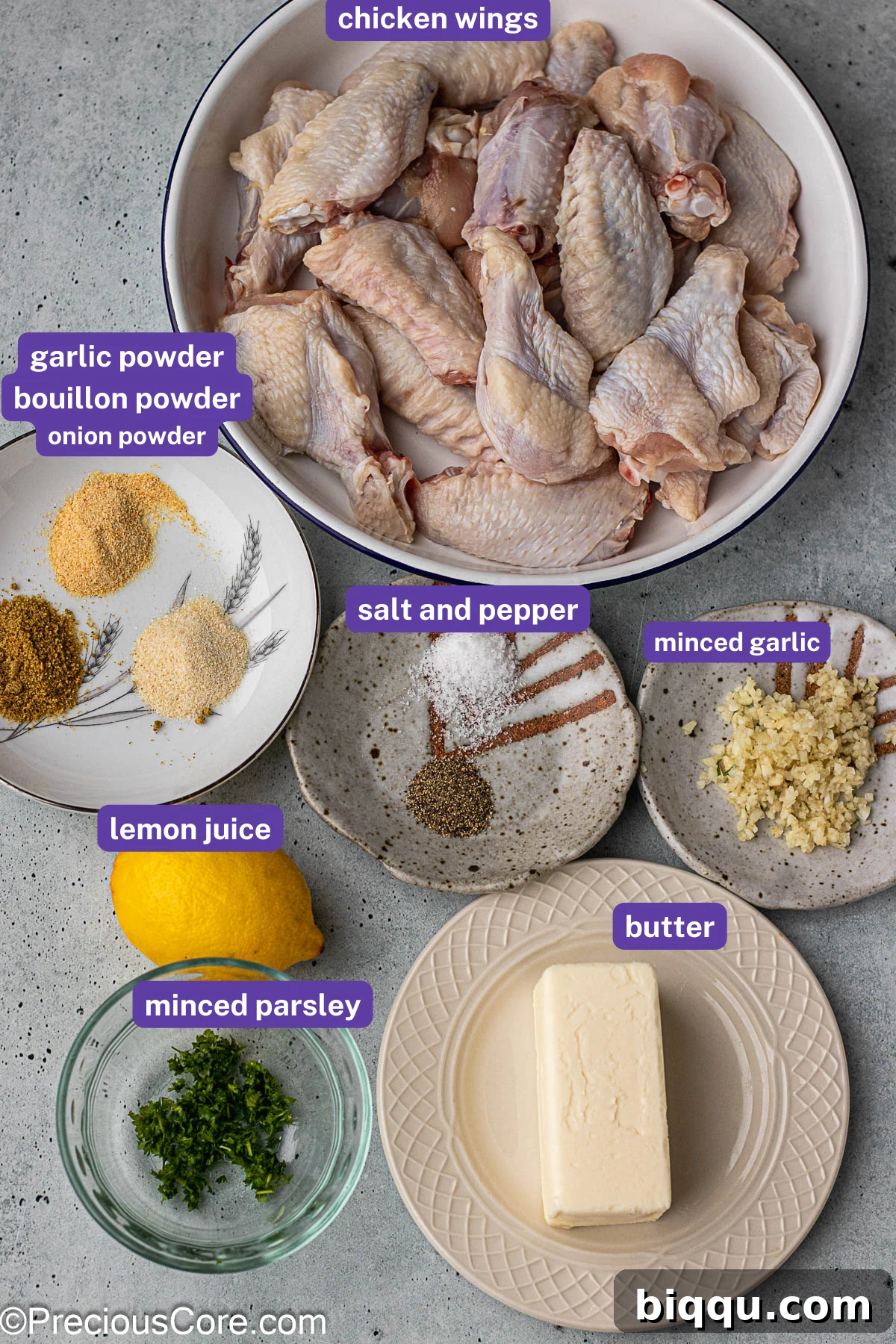 A vibrant flat lay showcasing all the fresh and dry ingredients needed for garlic butter chicken wings, each clearly labeled.