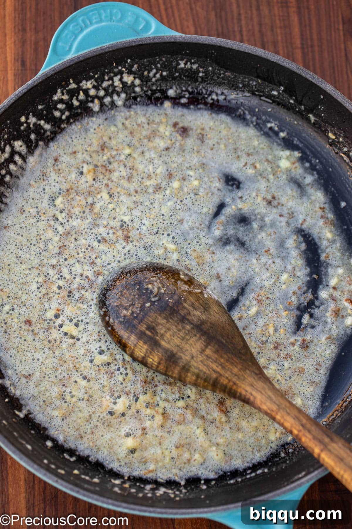 Silken Fish Delight 7 Melted butter and minced garlic simmering in a pan, with flour added to create a roux.