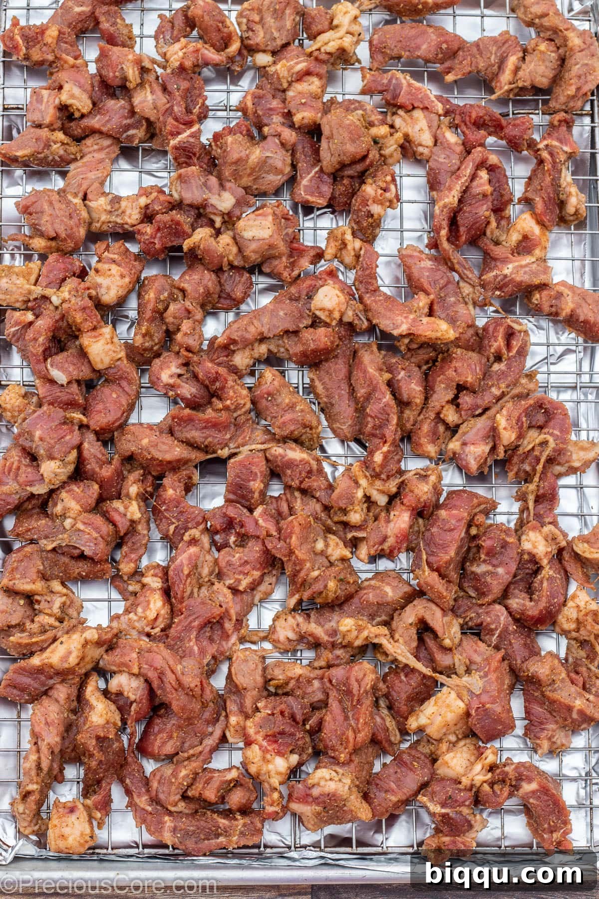 Beef on a baking sheet rack.