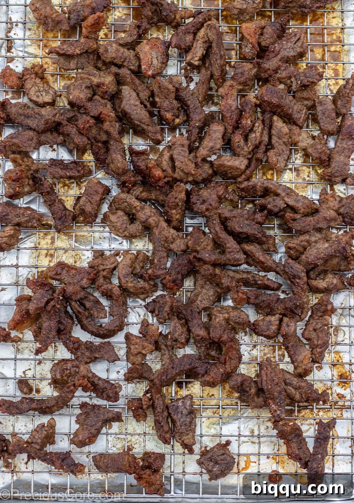 Grilled Cameroonian soya on a baking sheet rack.