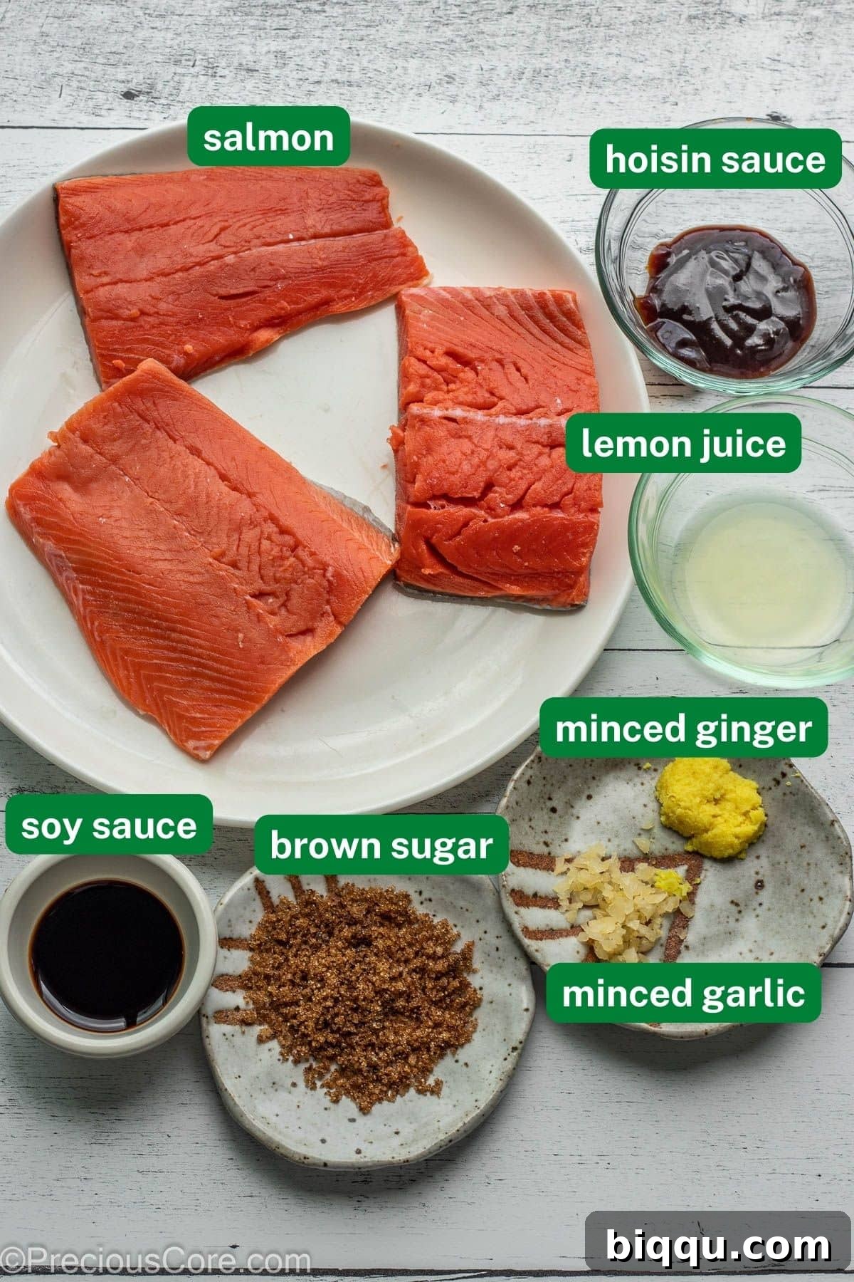 Ingredients for homemade teriyaki salmon, including salmon fillets, soy sauce, hoisin sauce, lemon, ginger, garlic, and brown sugar.