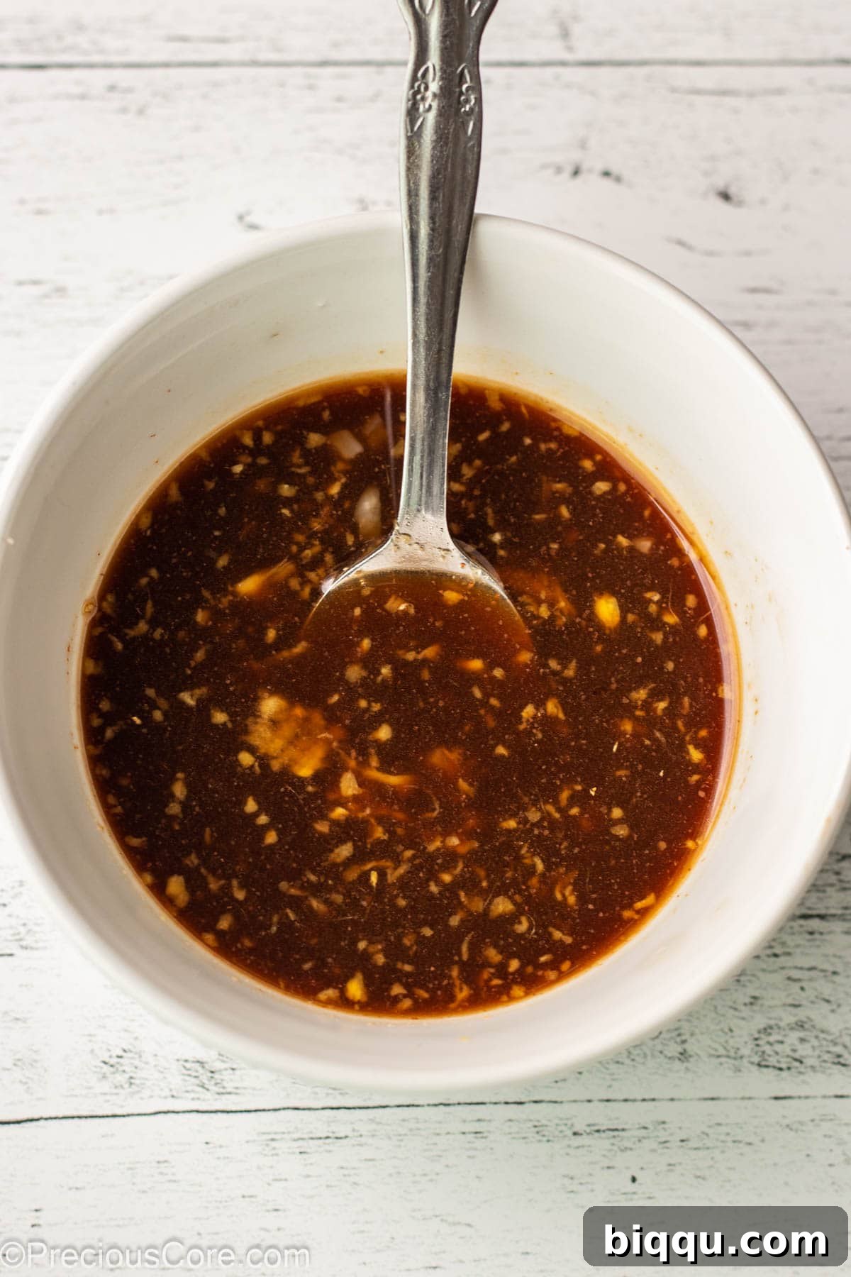 Ingredients for homemade teriyaki sauce whisked in a small bowl.