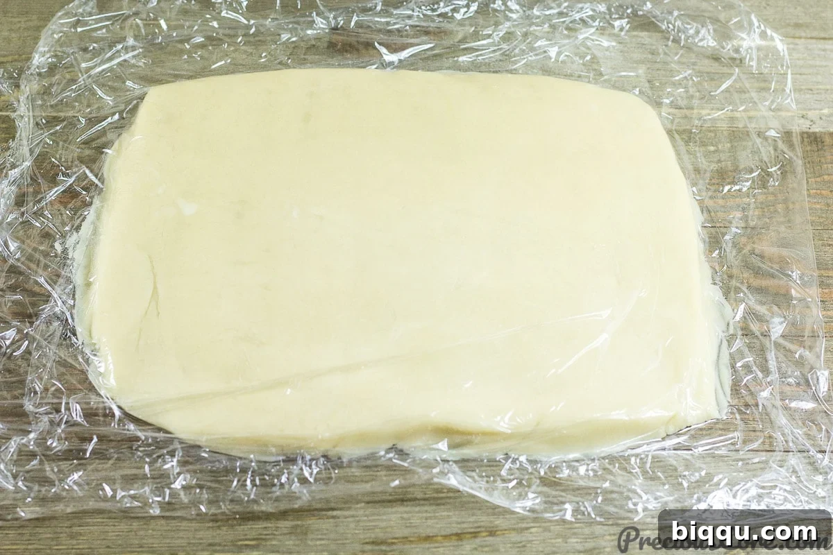 Effortless Homemade Shortbread 11 Rolling out dough for homemade shortbread cookies.