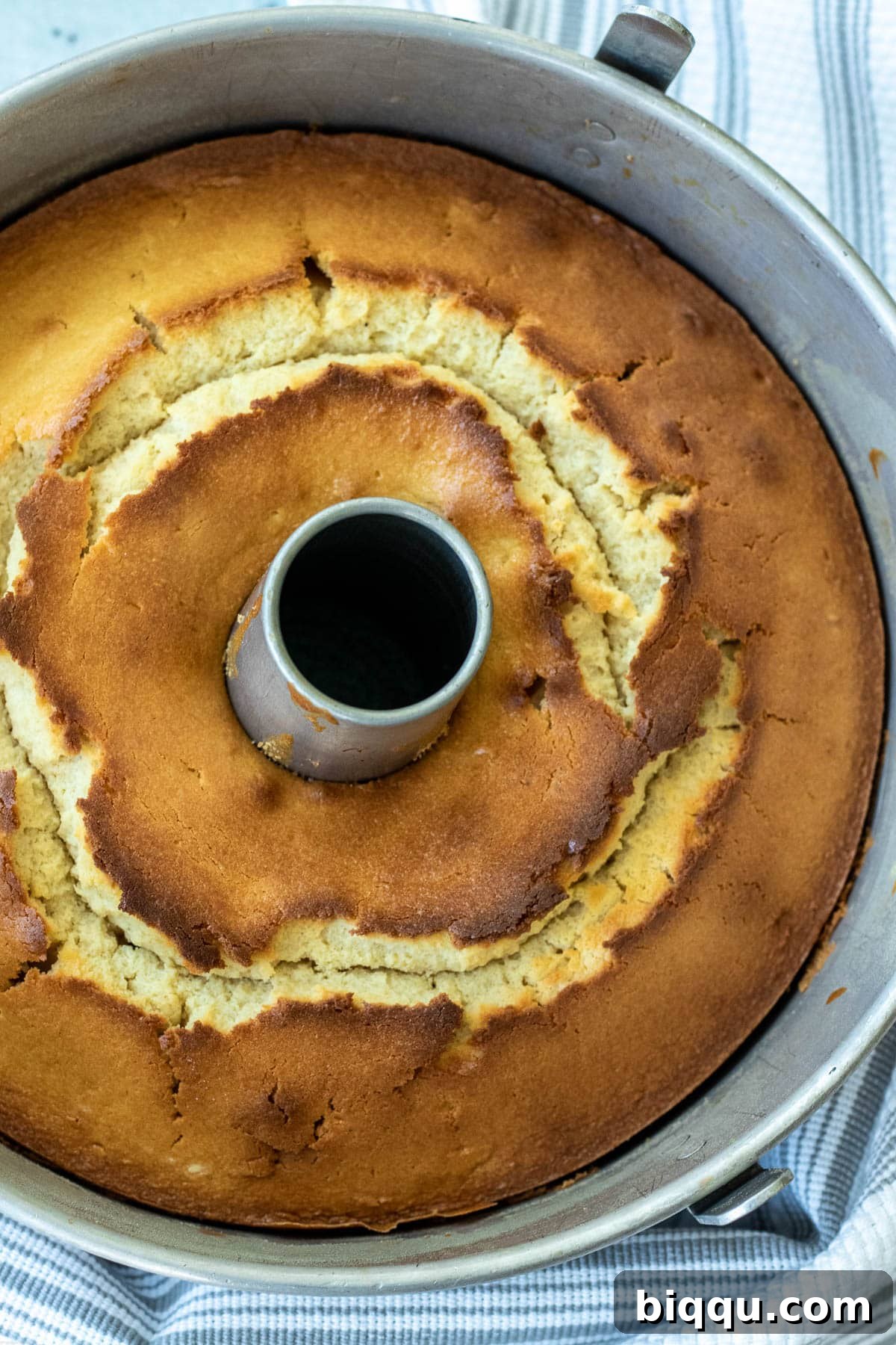 Freshly baked Pineapple Upside Down Pound Cake still in its bundt baking dish, cooling slightly.