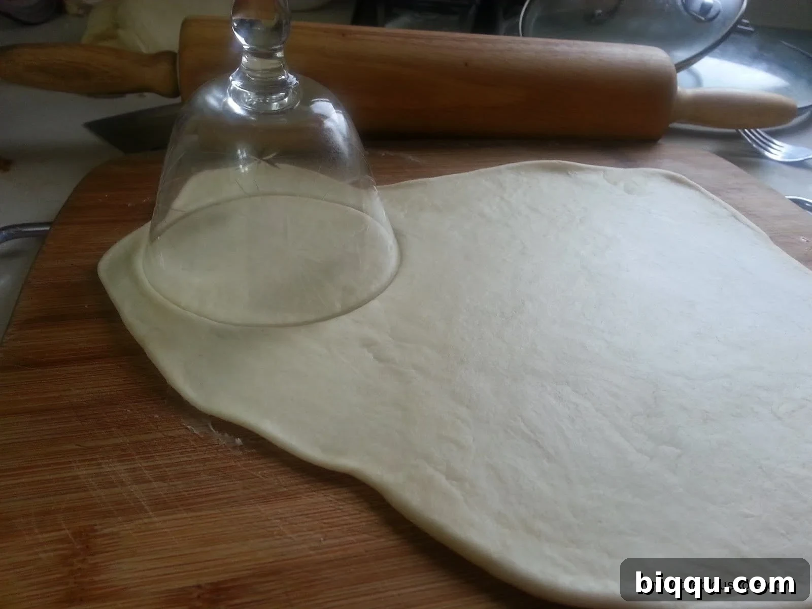 Dough rolled out and circles being cut for fish pies