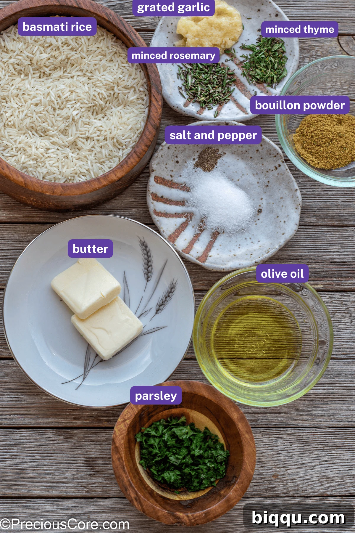 Fresh ingredients meticulously prepped and displayed on a rustic wooden board, with clear labels indicating olive oil, grated garlic, fresh rosemary, thyme, bouillon powder, salt, pepper, butter, and Basmati rice, all ready for cooking.