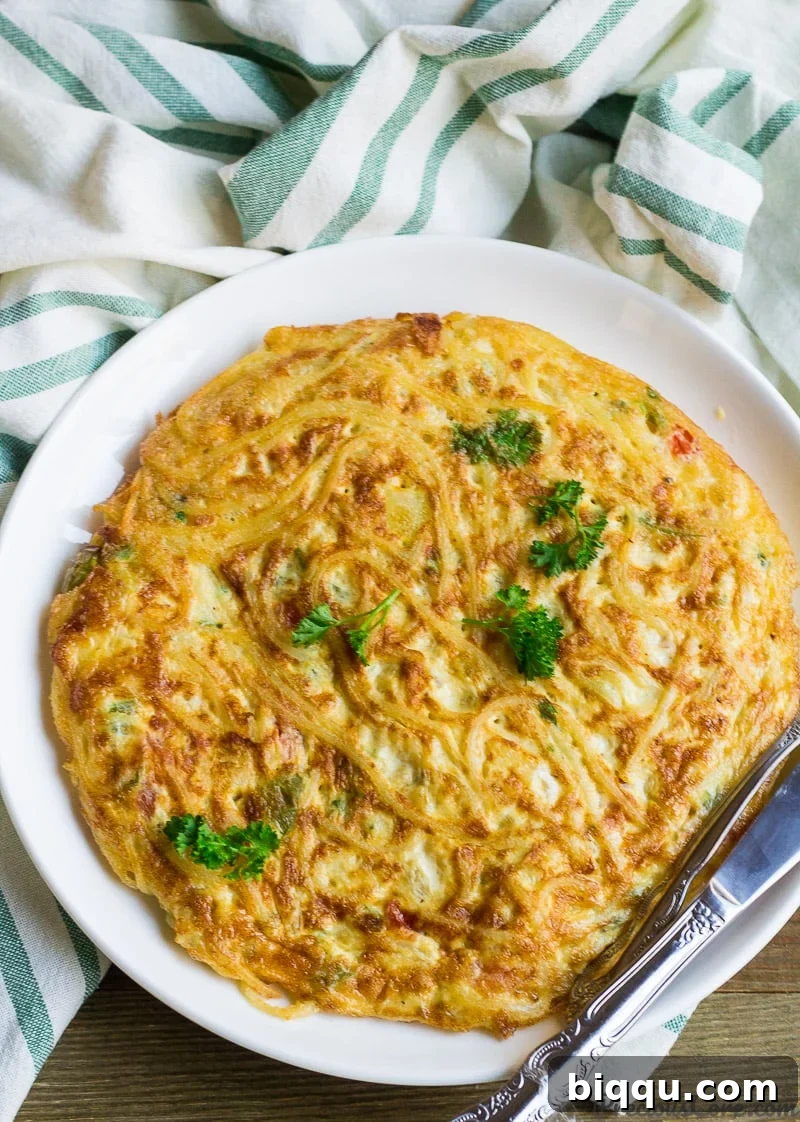 Delicious Spaghetti omelette on a plate, ready to be served