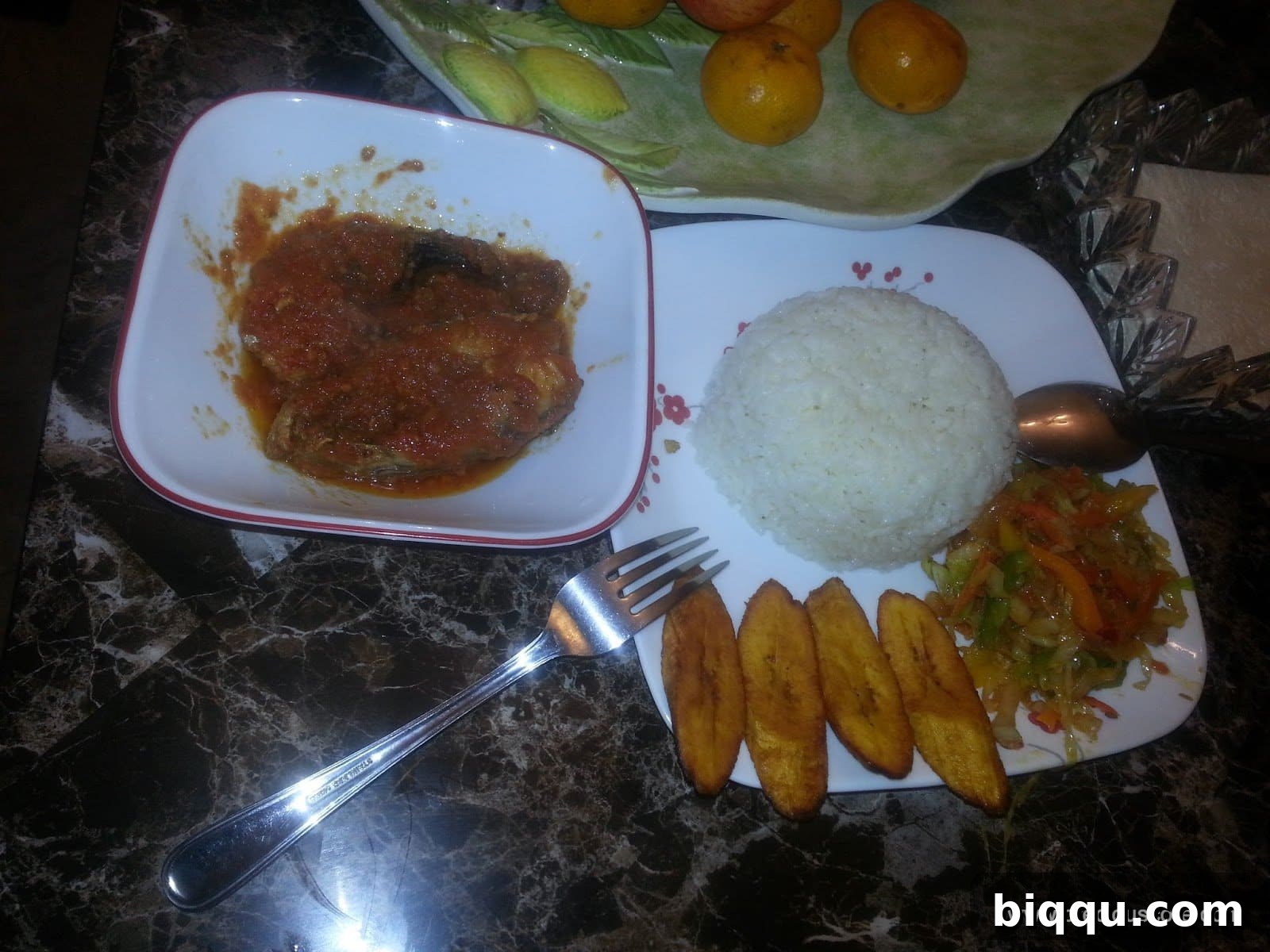 A vibrant plate of Cameroonian Mixed Vegetables served with delicious fried plantains, ready to be enjoyed.