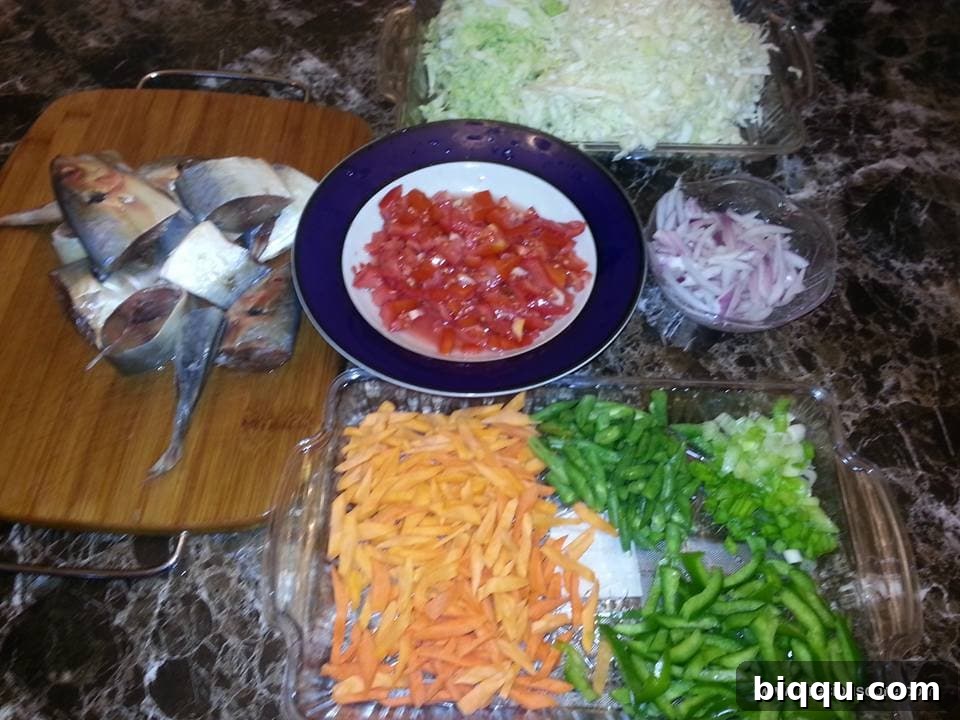 A selection of fresh protein options suitable for mixed vegetable stir-fry, including fish and shrimp.
