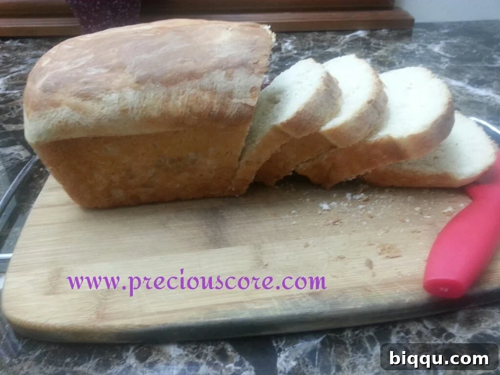 Two loaves of Kumba Bread cooling on a rack, ready to be sliced