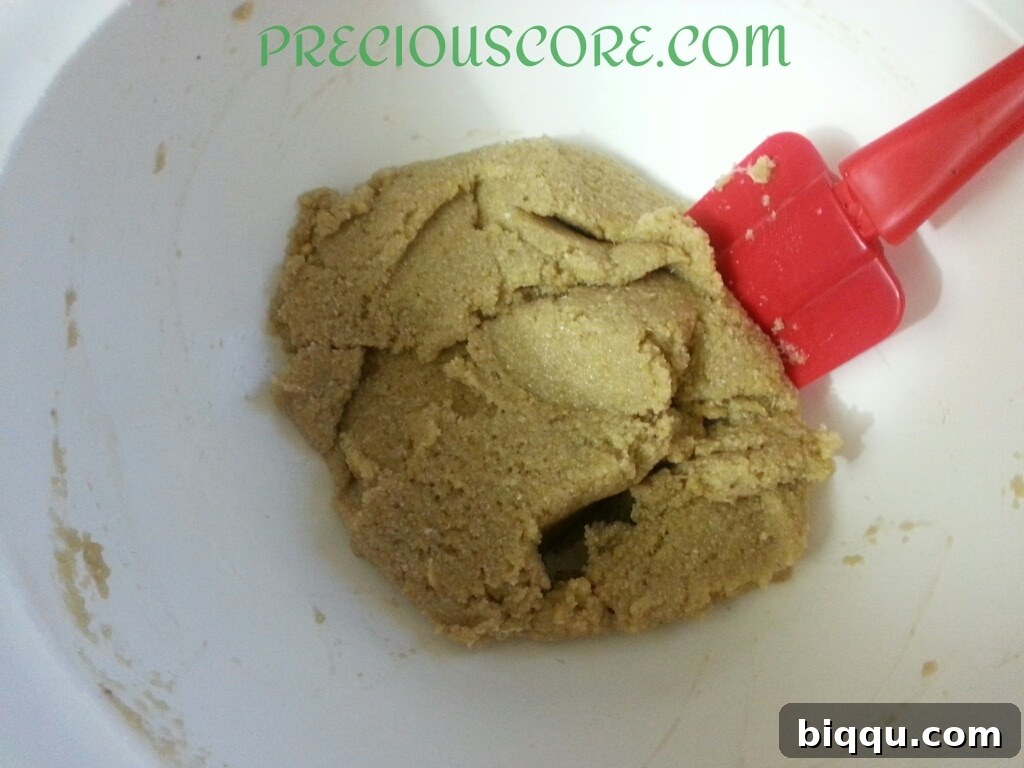 Heating vegetable oil in a pot over medium heat, preparing for frying the fritters