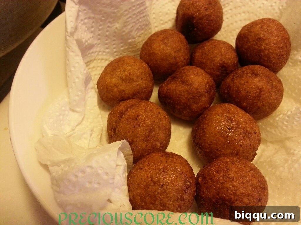 A generous serving of Accra Banana fritters, ready to be enjoyed with a side of pepper sauce