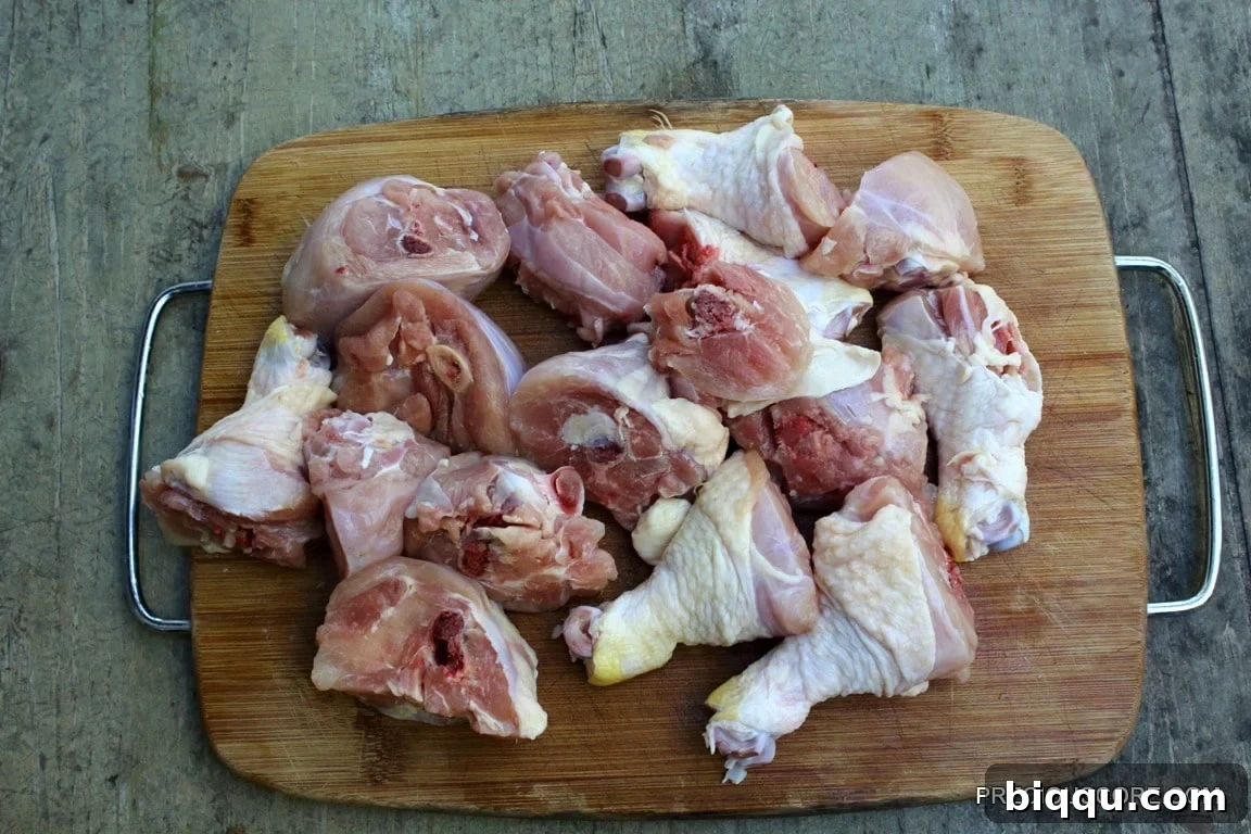 Fresh chicken drumsticks chopped into smaller pieces for soup.