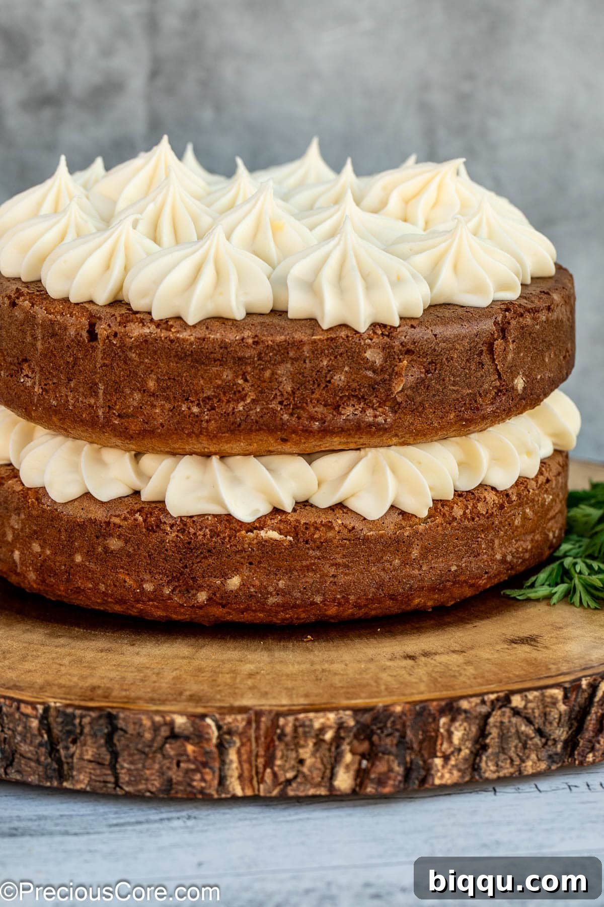 Decorated carrot cake with cream cheese frosting.