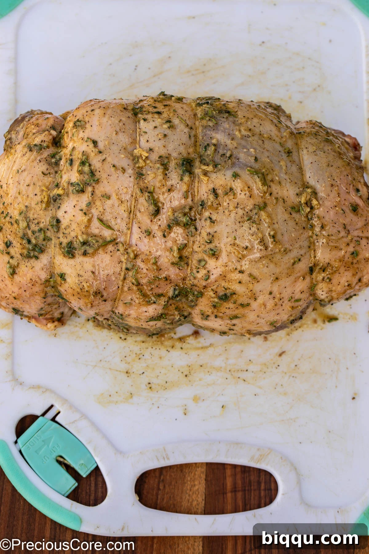 The seasoned and tied boneless leg of lamb, fully prepared for marination.