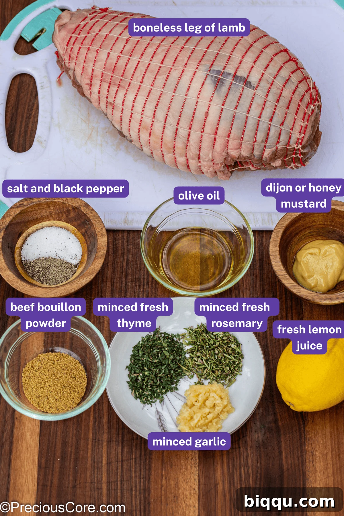 All the fresh ingredients for roasted lamb, clearly labeled and ready for preparation.
