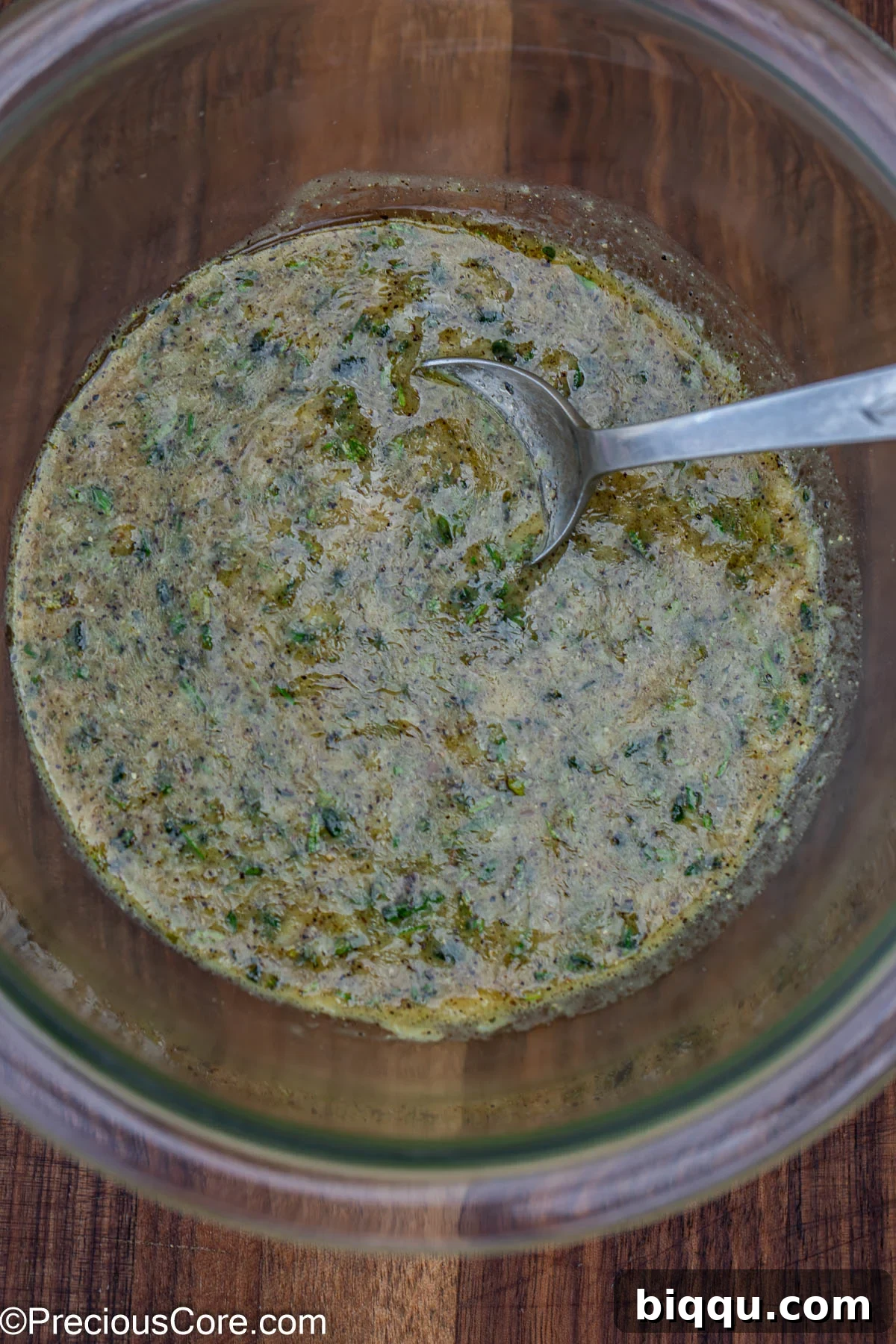 A vibrant marinade mixture in a mixing bowl, ready for the lamb.