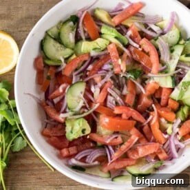 Kachumbari - tomato onion salad, a Kenyan staple for added freshness.