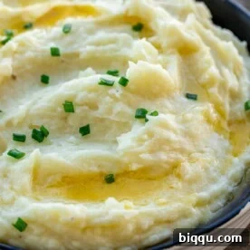 A bowl of buttermilk mashed potatoes, creamy and rich, ideal with roast chicken.