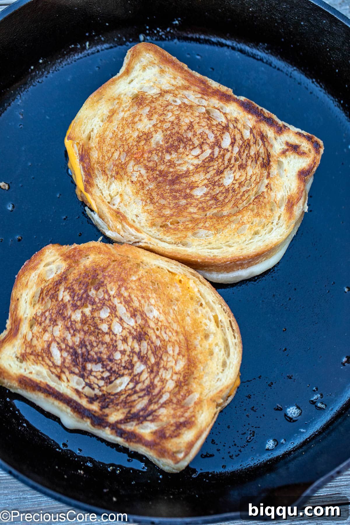 Sourdough grilled cheese in skillet.