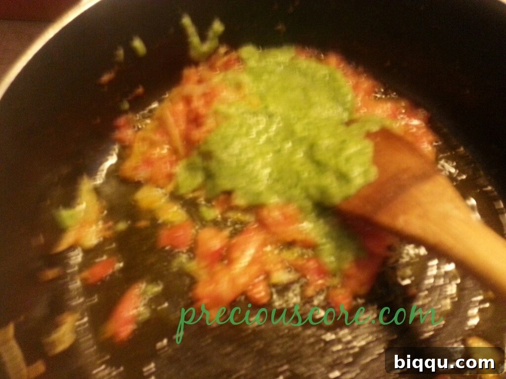 The Aromatic Sauce Base A closer view of the seasoned tomato mixture, rich and fragrant.