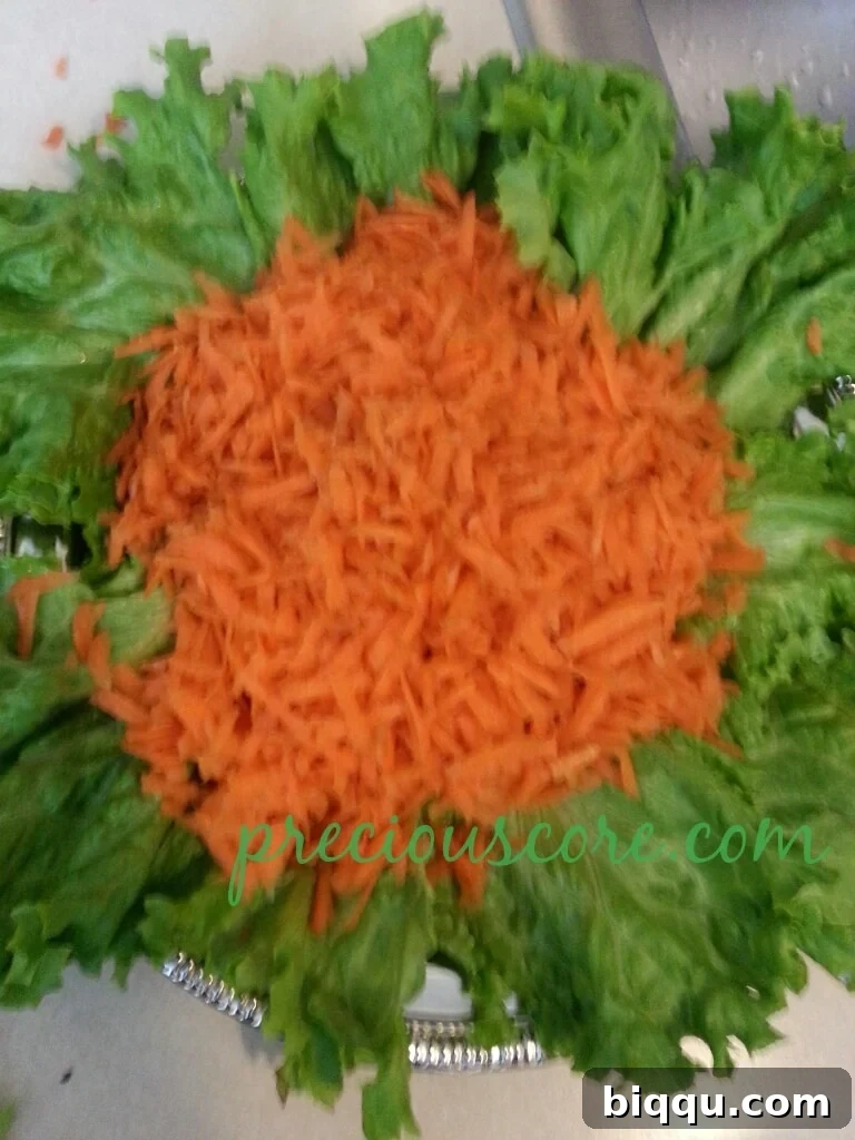 Finely sliced onion, adding its characteristic pungent touch to the layered lettuce salad