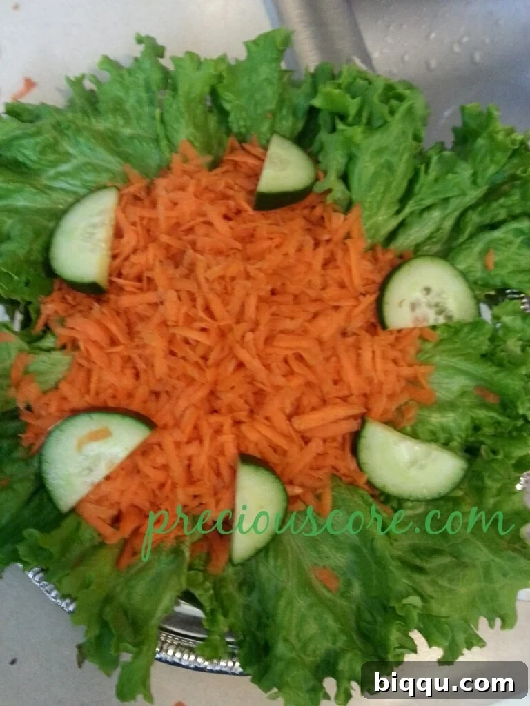 Refreshingly cut cucumber half-moon slices elegantly arranged on the salad