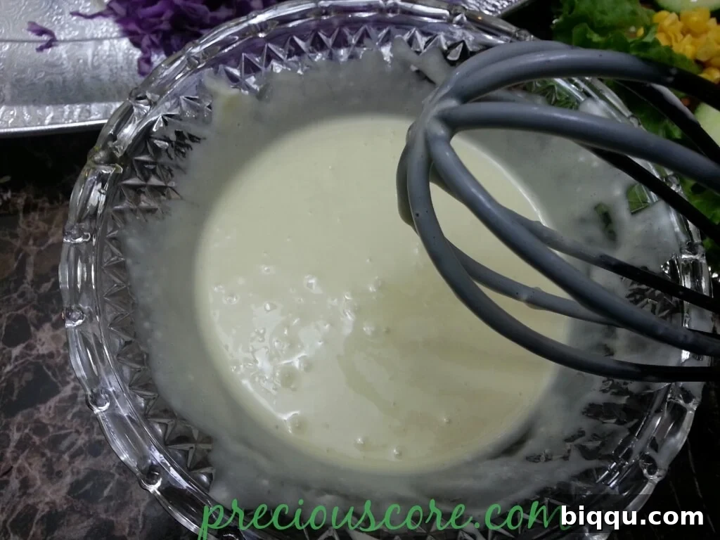Smooth and creamy salad dressing, perfectly whisked and ready to be served