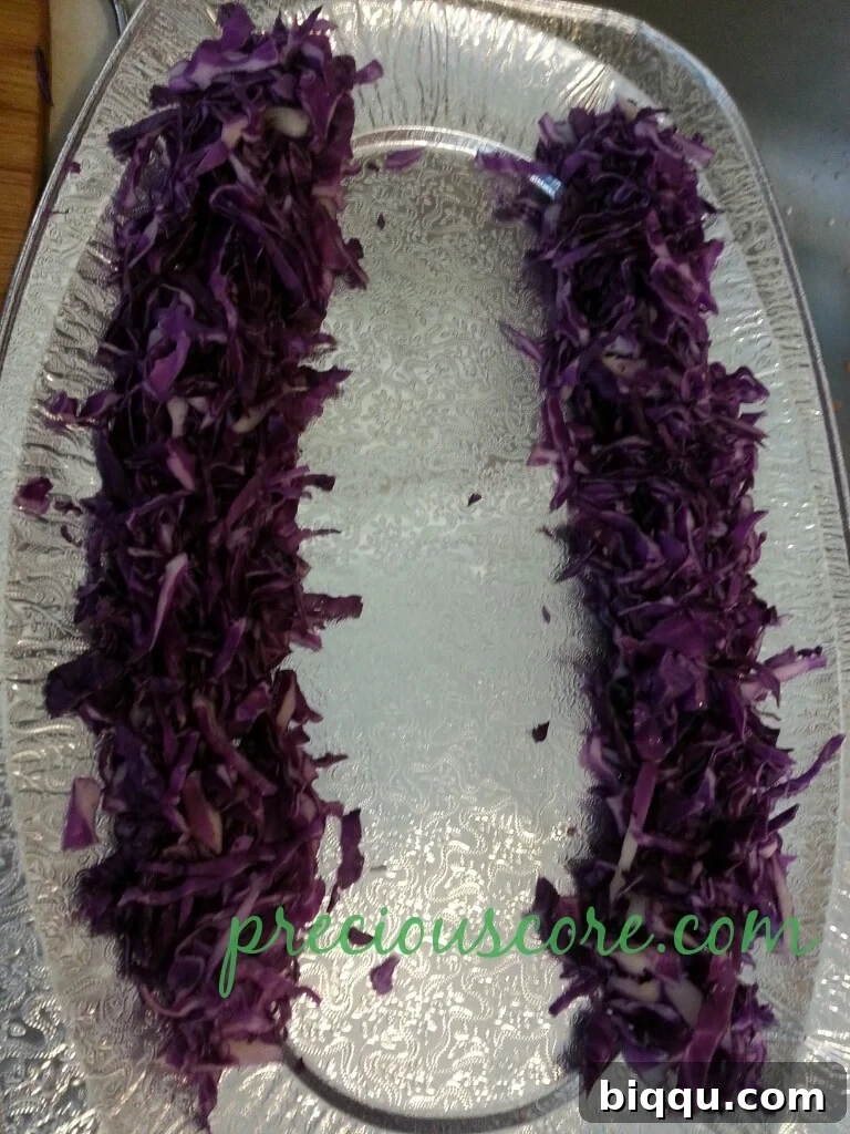 Artfully layered chopped red cabbage on a serving tray, showcasing its deep hue