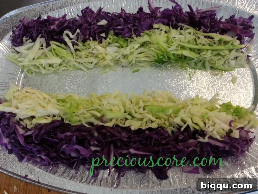 Crisp shredded white cabbage, freshly prepared for a layered salad
