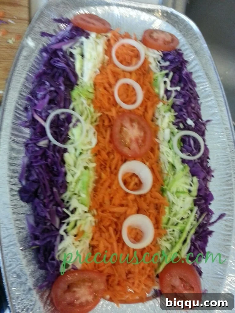 Artful arrangement of thinly sliced onion and tomato on a salad platter