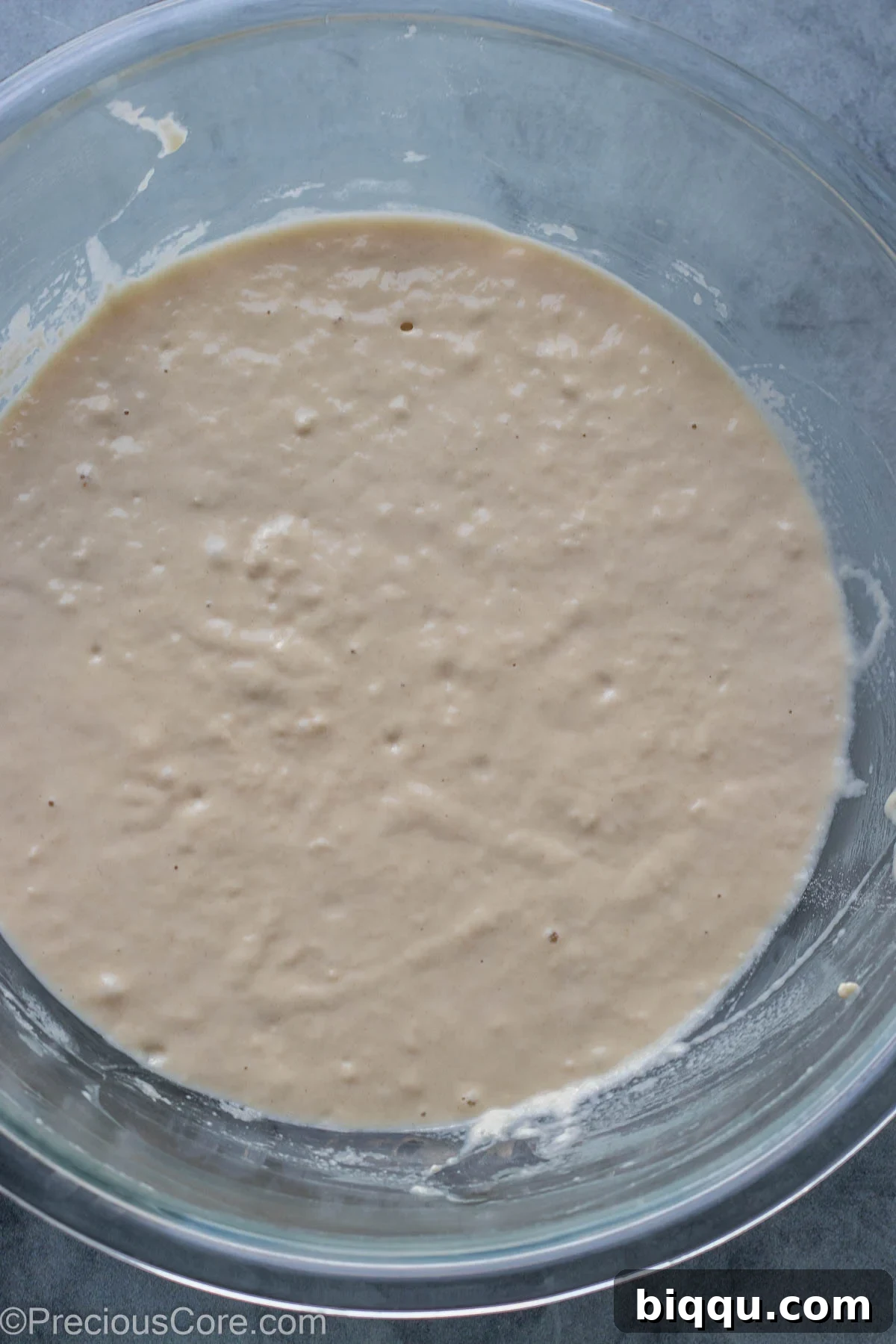 Close-up view of the mixed Puff Puff batter inside a bowl, showing its texture before rising.