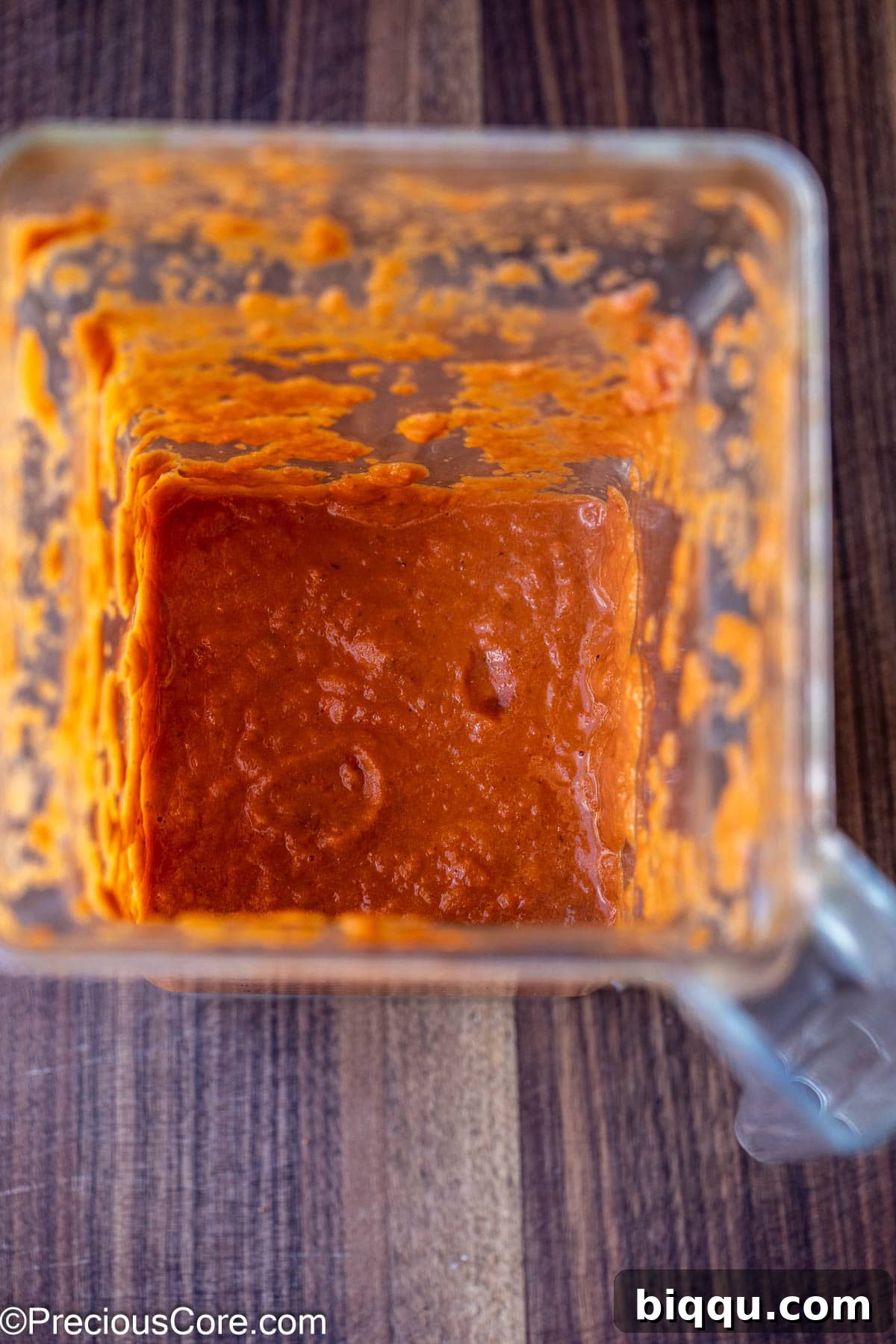 Creamy, blended roasted tomato sauce in a blender jug.
