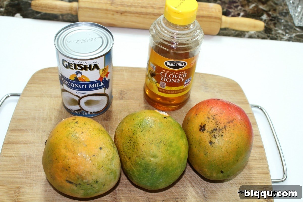 Close-up of three ripe mangoes