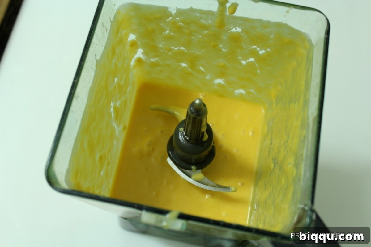 Blended mango mixture in a blender