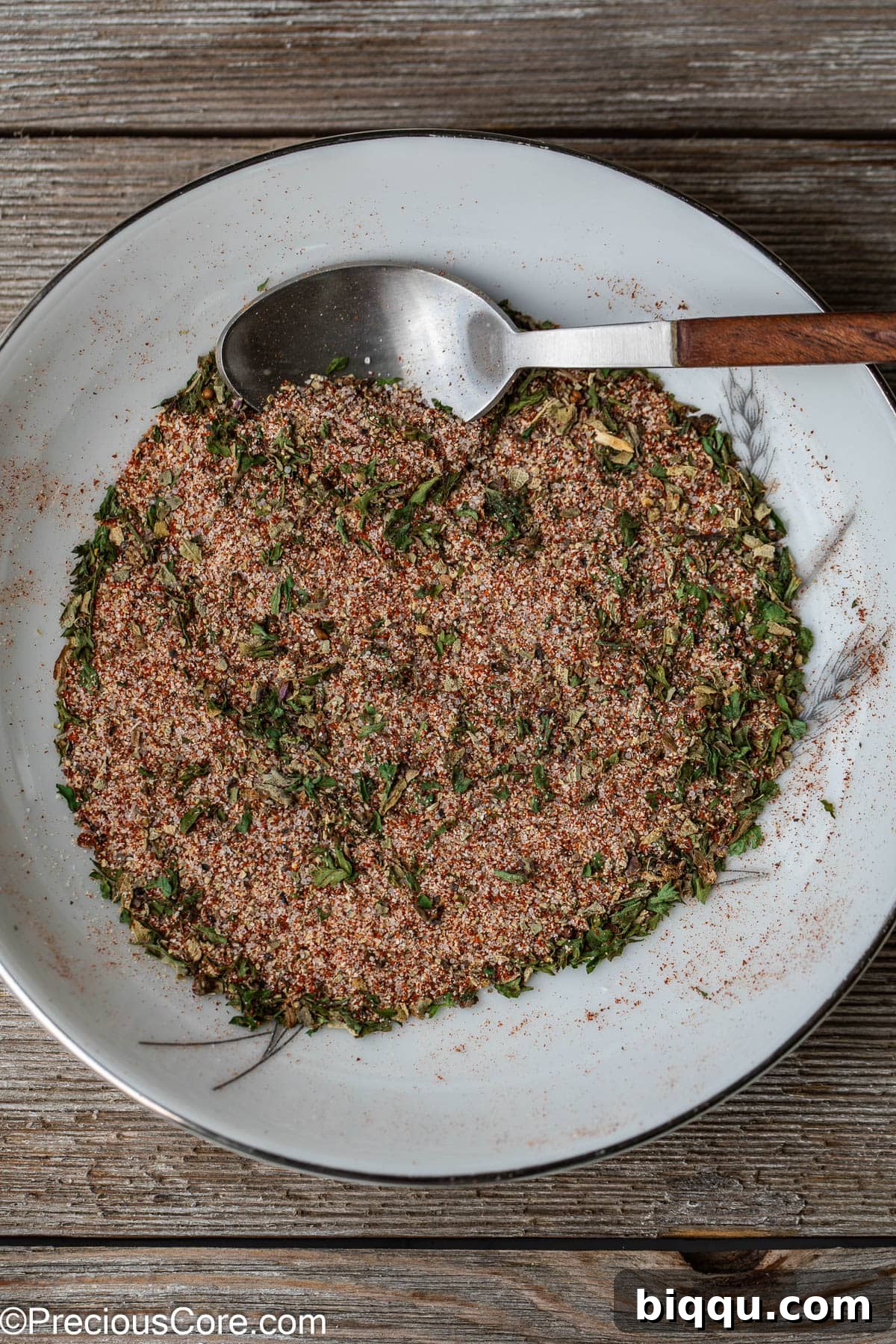 The blended homemade French fries seasoning displayed on a white plate, ready for use.
