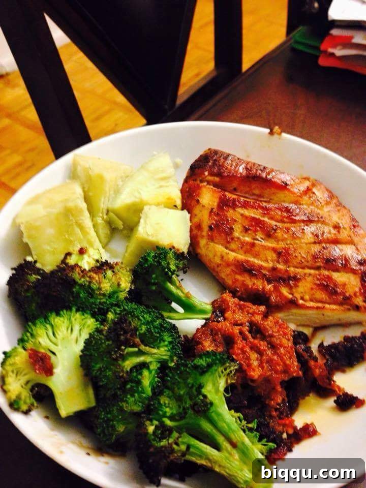 Nora's healthy meal, a colorful plate of chicken and steamed vegetables.