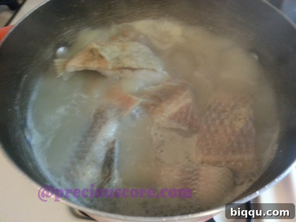 A bowl of freshly cooked Cameroonian Fish Pepper Soup, ready to be served.
