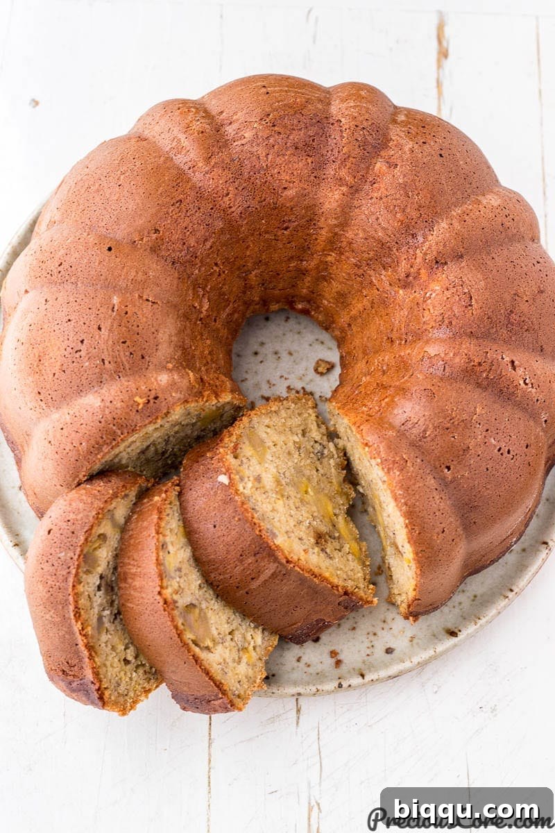 Sliced plantain bundt cake on a plate.