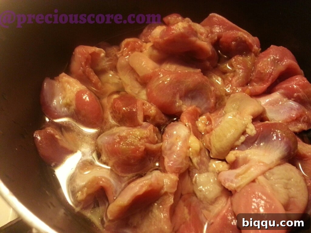 Chicken gizzards in a pan with water