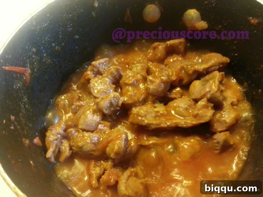 Gizzards frying in rich, thick sauce