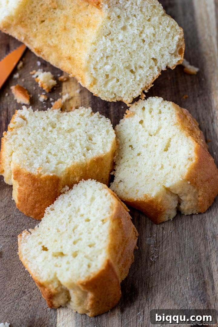 Slices of moist yogurt cake arranged on a chopping board for serving.