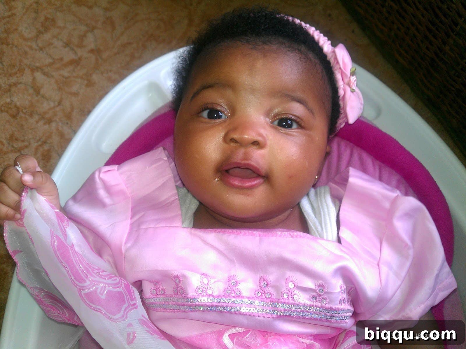 Baby girl looking curiously at the camera