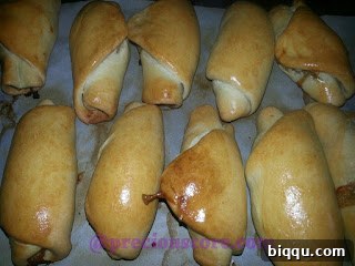 Close-up of a perfectly baked, shiny chicken roll