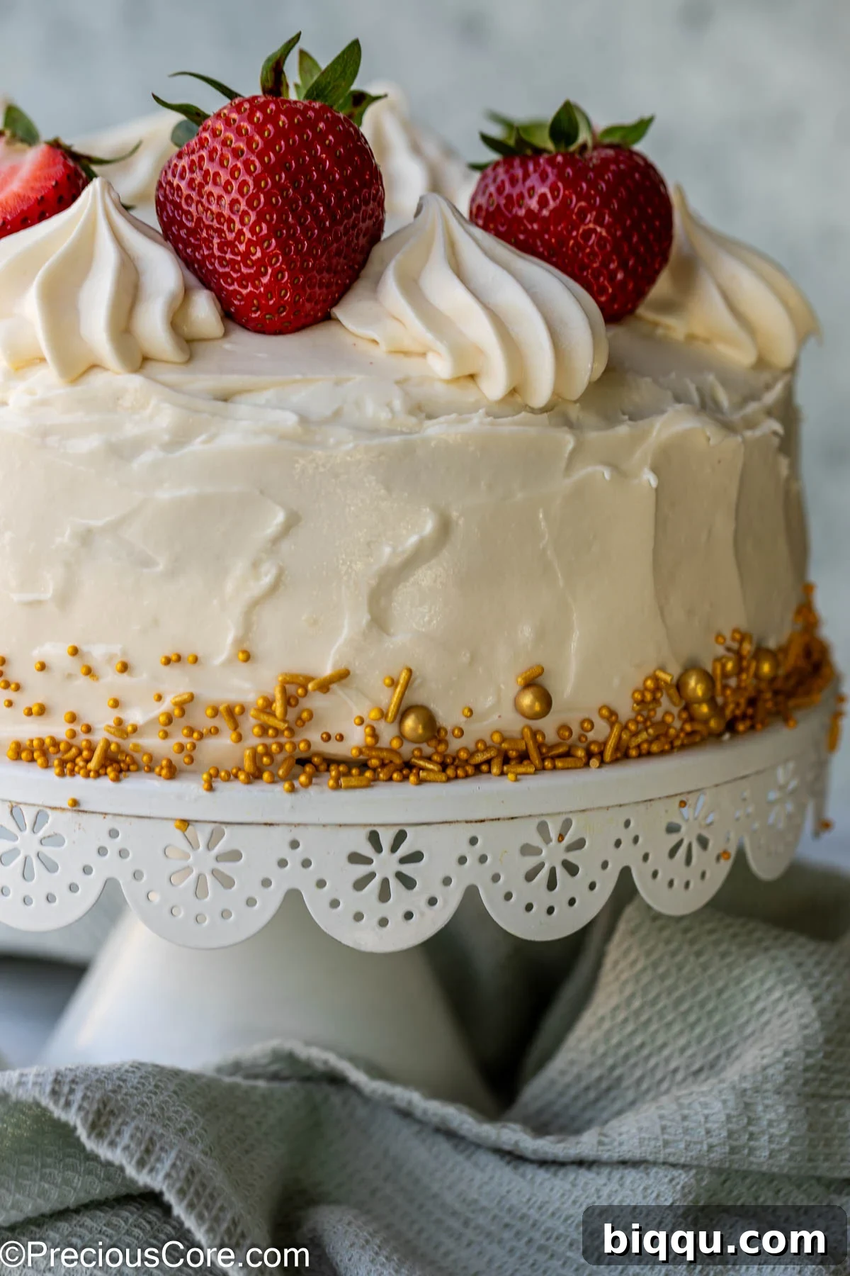 Velvet Dream Cake Without Buttermilk 15 A fully frosted red velvet cake, beautifully decorated and ready to be served, showcasing the rich red cake and creamy white frosting.