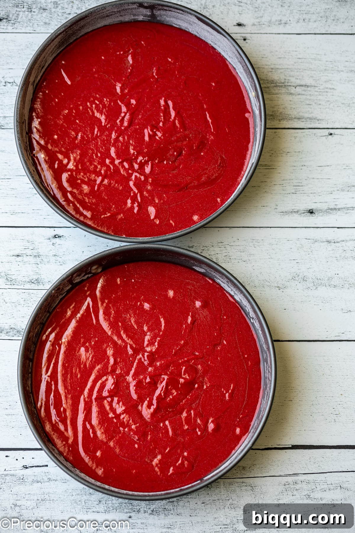Velvet Dream Cake Without Buttermilk 10 Red velvet cake batter evenly distributed in two 9-inch round cake pans, ready for the oven.
