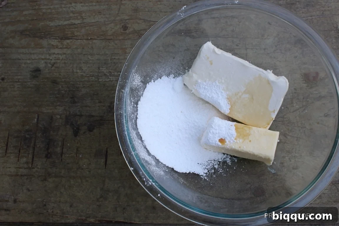 Cream cheese filling ingredients in a mixing bowl, ready to be combined.