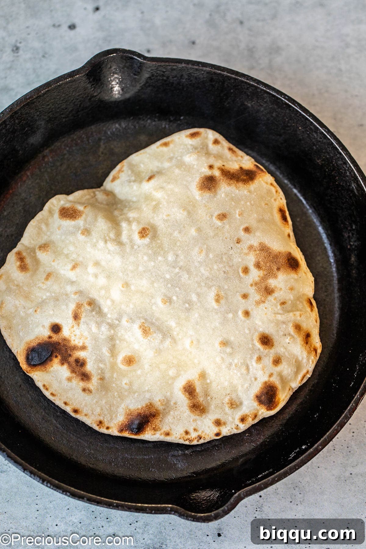 Golden Shawarma Wraps 11 Shawarma bread puffing up in a skillet.