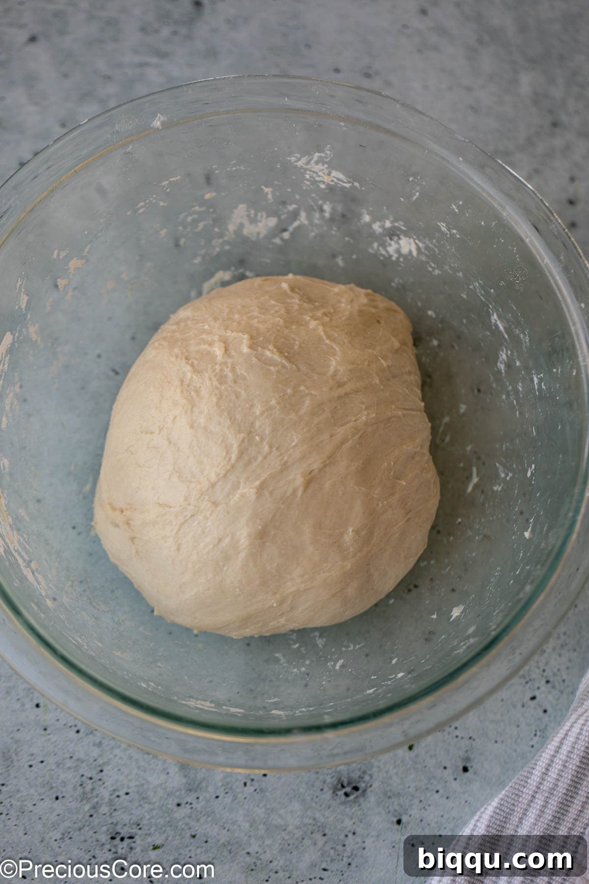 Golden Shawarma Wraps 7 Smooth bread dough in a glass bowl.