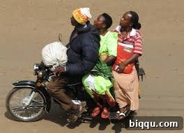 An Okada (motorbike taxi) in action on a Cameroonian street, offering a quick ride and a refreshing breeze.